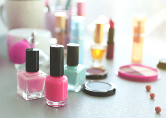 Obraz na płótnie Canvas Nail polish with makeup cosmetics on a table