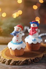 Christmas cupcakes on wooden stand