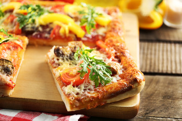 Pieces of delicious pizza on the table, close-up