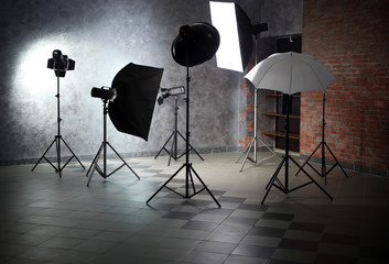 Empty photo studio with lighting equipment
