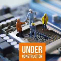 miniature people engineer fix computer 