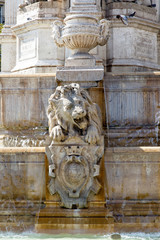 Color DSLR stock image of a carved lion in the fountain the plaza fronting the Church of Saint-Sulpice, Paris, France