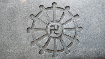 the swastika carved on the stone