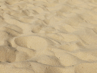 closeup of sand pattern of a beach in the summer