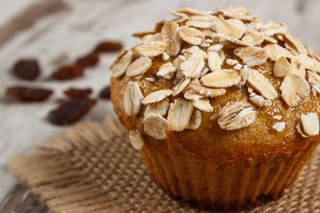 Fresh muffin with oatmeal baked with wholemeal flour and raisins, delicious healthy dessert