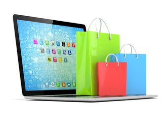 laptop and  shopping pags on white background