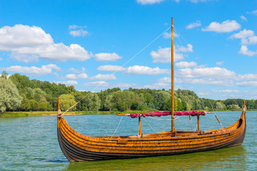 Vintage wooden Viking boat on the lake
