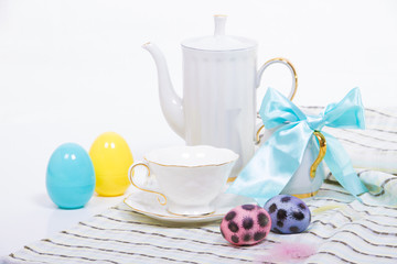 Easter still life with white tea service