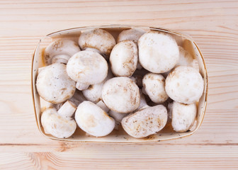 Fresh mushrooms on wooden table.