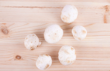Fresh mushrooms on wooden table.