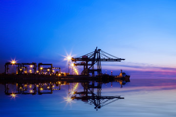 Fototapeta na wymiar Freight dock of container crane at night