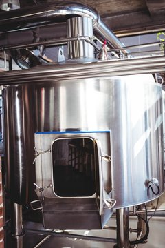 Large silver vats of beer
