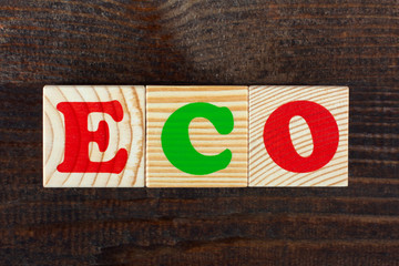 the word from children's wooden blocks with colorful letters on wooden table