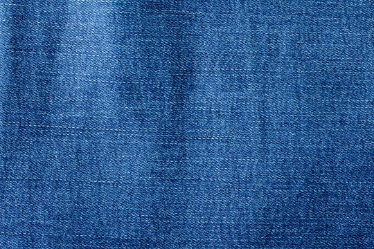 Denim fabric texture ideal for background, closeup of jeans