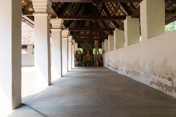 walkway to golden buddha statue