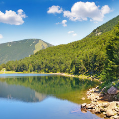 picturesque lake, mountains and blue sky