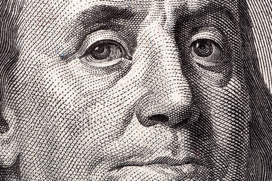 Benjamin Franklin, a close-up portrait on US hundred dollars 