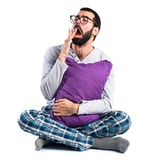 Man in pajamas yawning