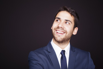 Business man thinking on black background