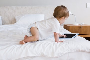 Cute baby using tablet 