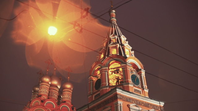 Bell-ringer at belfry of the old Russian church