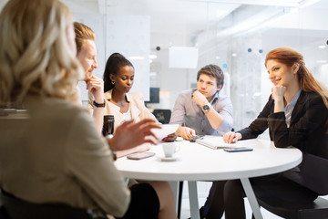 Fototapeta premium Group of business people sitting at desk