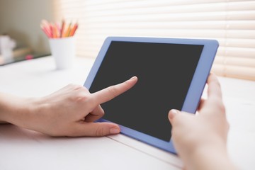 Close up view of businesswoman using her tablet