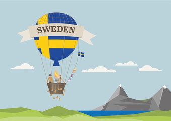 Fototapeta na wymiar Air Balloon with Swedish flag and people