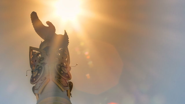Sun passing over Stele monument Kazakh Eli with bird Samruk timelapse.