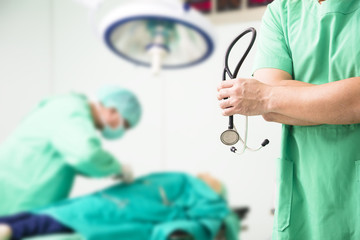 doctor working in surgical operating room and surgeon concept