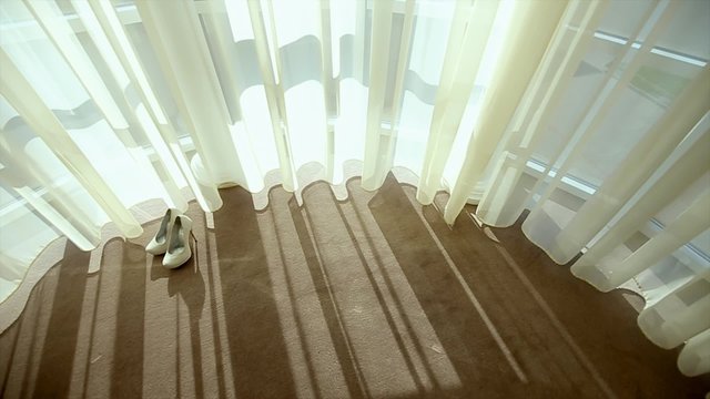 Wedding Shoes Stand on Floor Near Window
