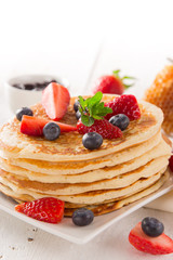 Stack of pancakes with fresh berries