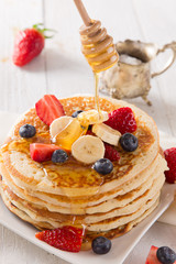 Stack of pancakes with fresh berries