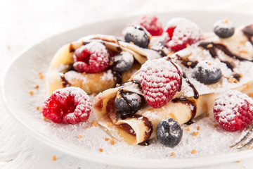 Stack of pancakes with fresh berries