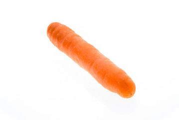 Organic big ripe fresh carrot isolated on white background.