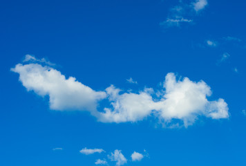 Fototapeta na wymiar white fluffy clouds in the blue sky
