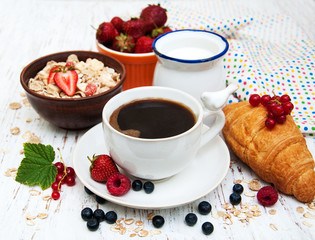 Fresh berries, coffee and croissant