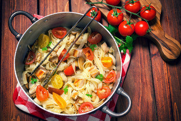 Homemade pasta with mushroom,chicken meat and vegetables