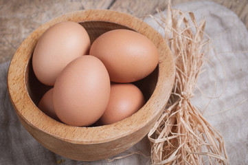 Eggs in wooden bowl
