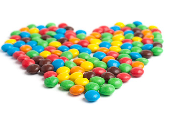 Multicolored candy heart isolated on white