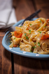 Homemade pasta with chicken meat