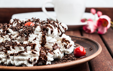 dessert meringue with cherries and chocolate