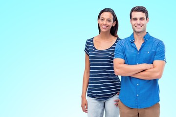 Fototapeta premium Composite image of couple looking at camera 