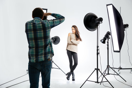 Photographer working with female model