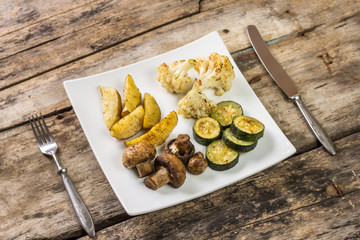 Grilled vegetables on white plate in restaurant