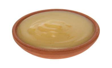 Small bowl of packaged gravy isolated on a white background