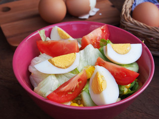 Fresh hard boiled eggs and salad with tomatoes