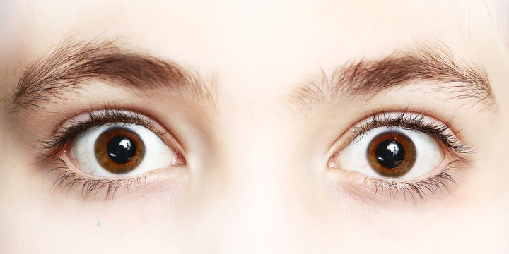 close up photo of boy eyes wide open
