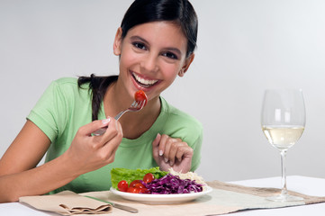 Woman eating salad