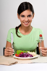 Woman eating salad